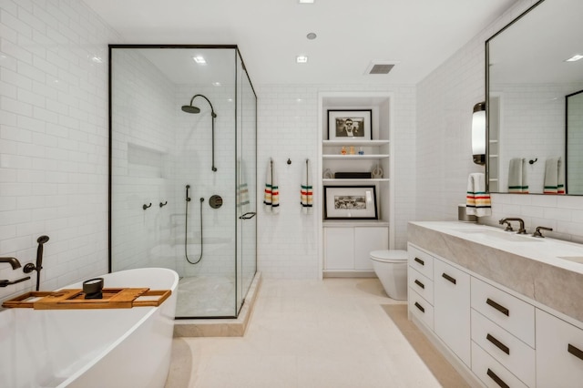 full bathroom with vanity, decorative backsplash, tile walls, toilet, and plus walk in shower