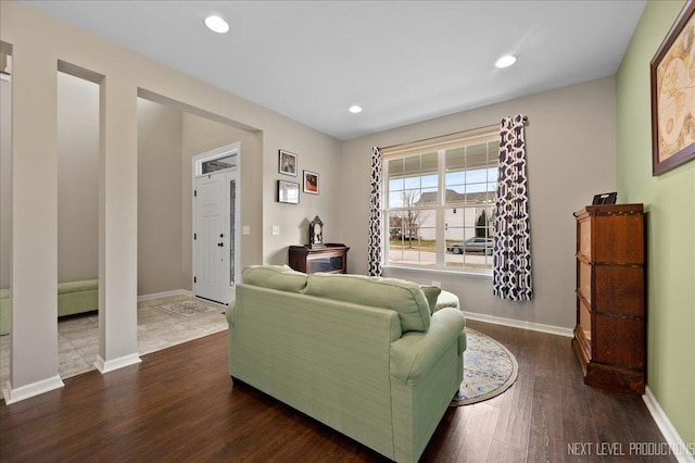 living room with dark hardwood / wood-style floors