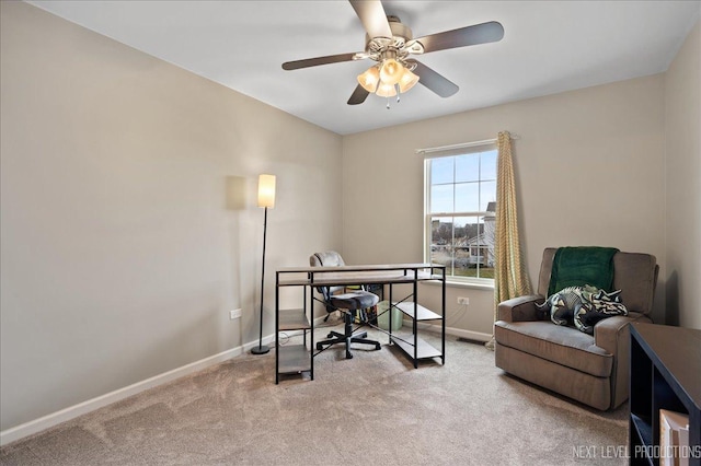 home office featuring light carpet and ceiling fan