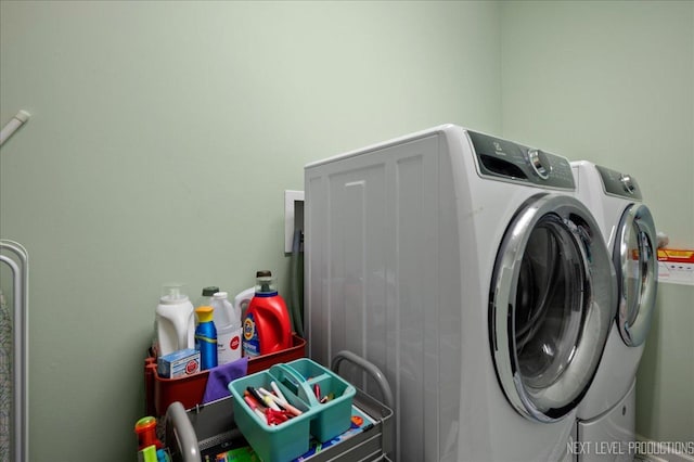 washroom with independent washer and dryer