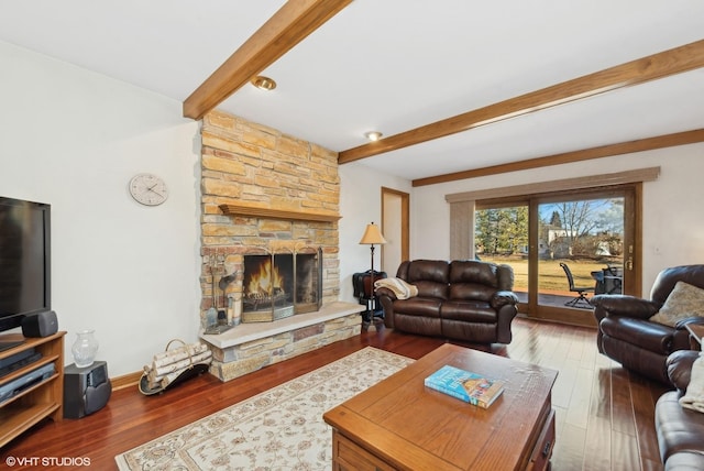 living room featuring hardwood / wood-style flooring, a fireplace, and beam ceiling