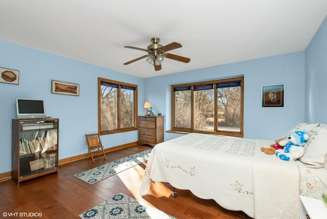 bedroom featuring ceiling fan and dark hardwood / wood-style floors