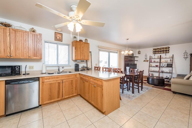 kitchen featuring sink, kitchen peninsula, dishwasher, and plenty of natural light