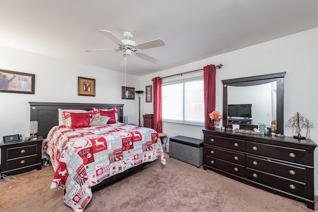 bedroom featuring light carpet and ceiling fan