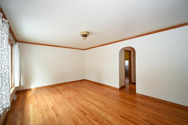 unfurnished room with wood-type flooring and ornamental molding