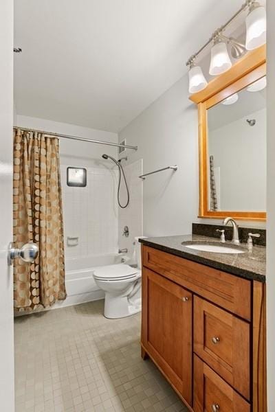 full bathroom with toilet, vanity, and shower / bath combination with curtain