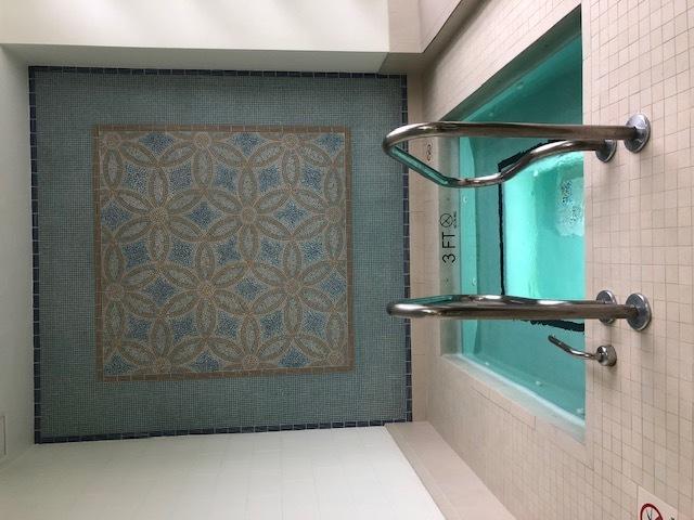 bathroom with tile walls