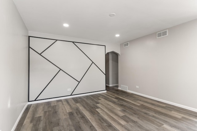 unfurnished bedroom featuring wood-type flooring and a closet