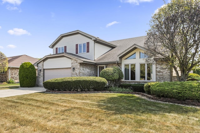 front facade with a front lawn and a garage