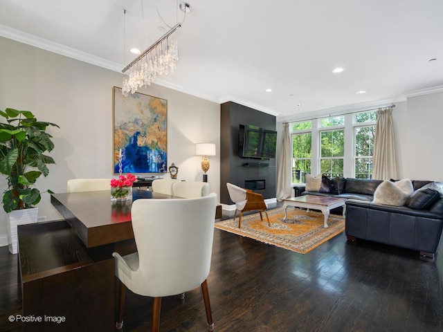 dining area with dark wood-type flooring, ornamental molding, floor to ceiling windows, and a notable chandelier