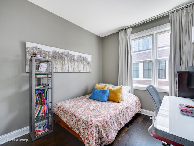 bedroom featuring dark hardwood / wood-style flooring