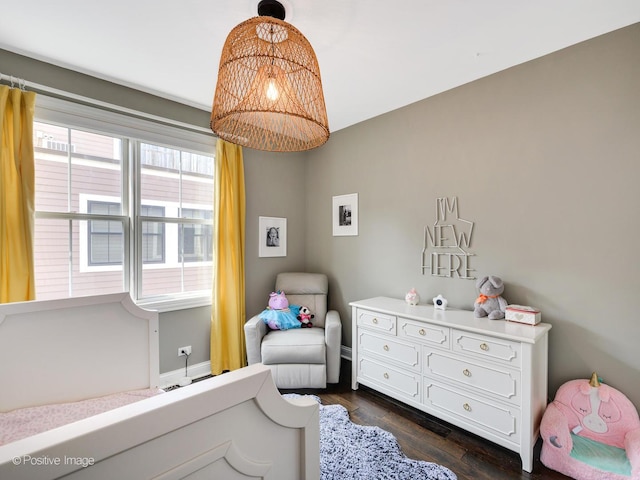 bedroom featuring dark hardwood / wood-style flooring