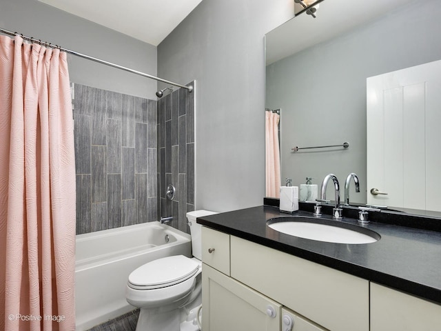 full bathroom with shower / bath combination with curtain, vanity, and toilet