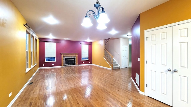 unfurnished living room featuring wood-type flooring