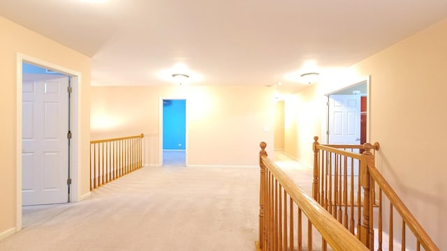 corridor with light colored carpet