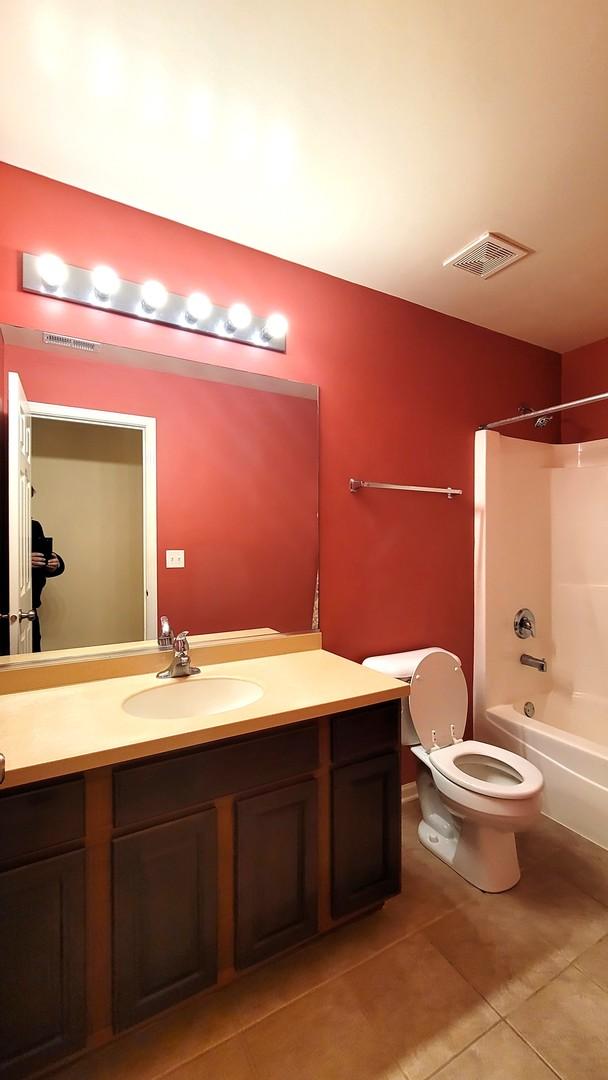 full bathroom featuring tile patterned flooring, vanity, shower / bathing tub combination, and toilet