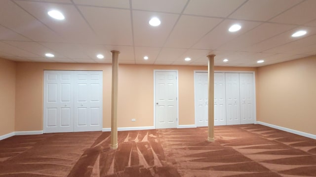 unfurnished bedroom with dark carpet and two closets