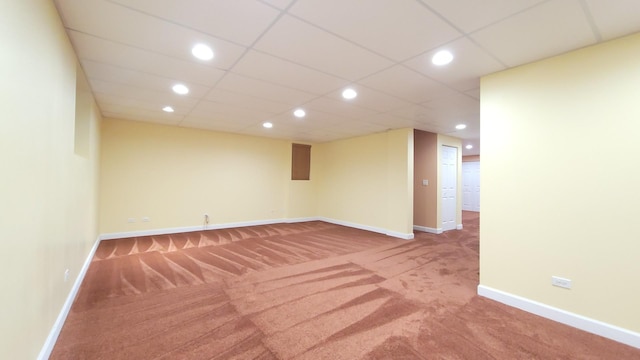 spare room with carpet floors and a paneled ceiling