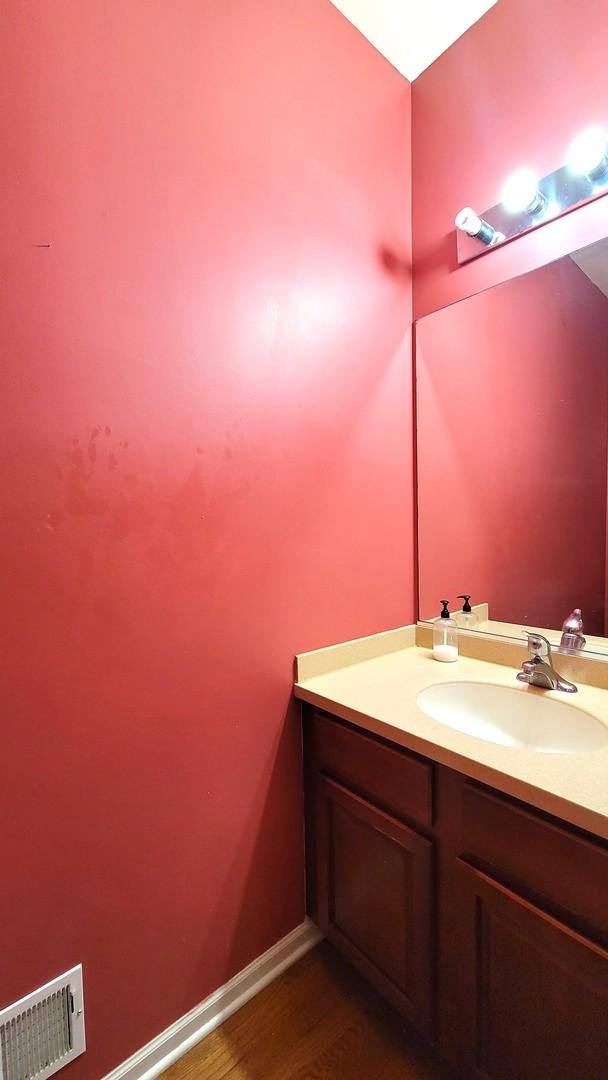 bathroom featuring vanity and hardwood / wood-style flooring