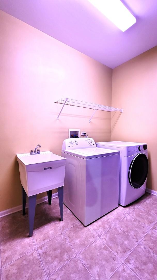 laundry room with independent washer and dryer