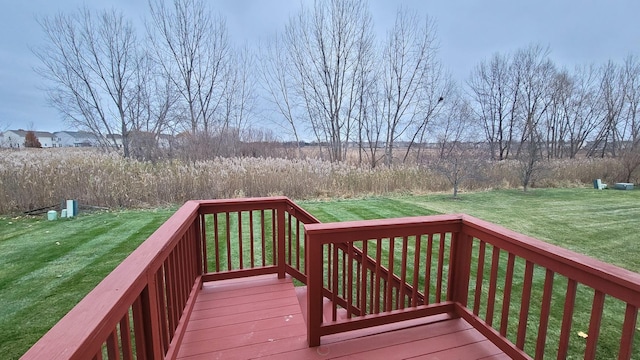 wooden terrace with a lawn