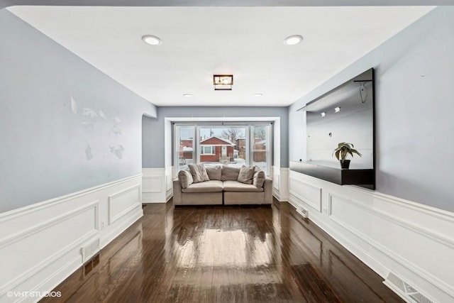 hallway with dark hardwood / wood-style flooring