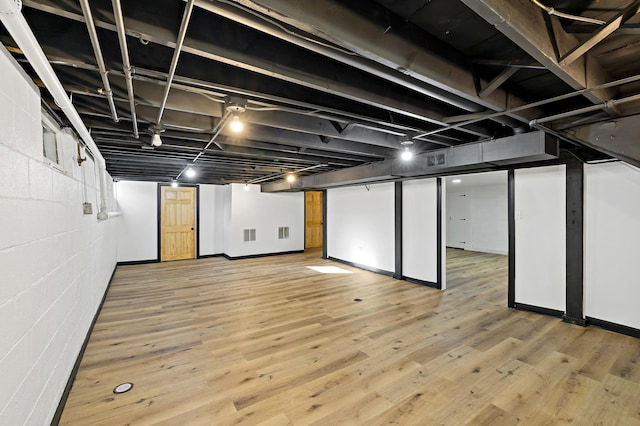 basement featuring light hardwood / wood-style floors