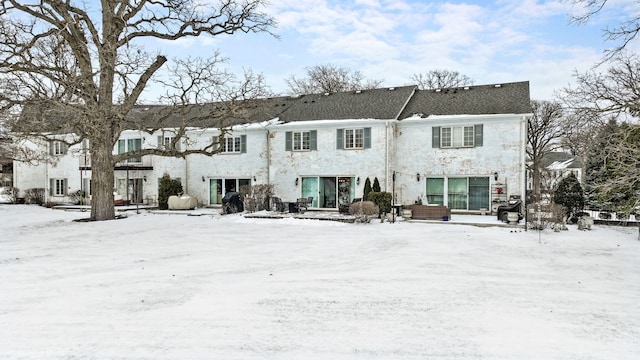 view of snow covered house