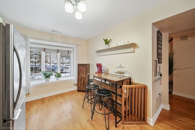 dining room with light wood-type flooring