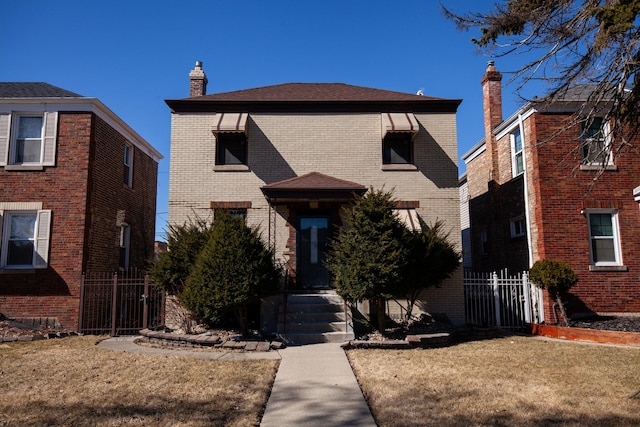 view of front facade featuring brick siding, a chimney, and fence