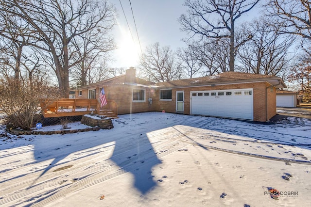 view of front of home with a garage and a deck