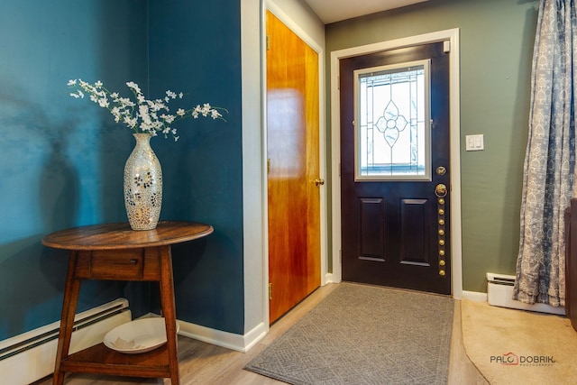 foyer featuring wood-type flooring and baseboard heating