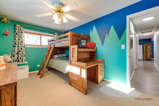 carpeted bedroom featuring ceiling fan