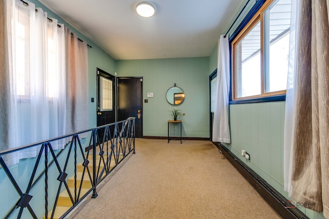 hallway featuring carpet flooring