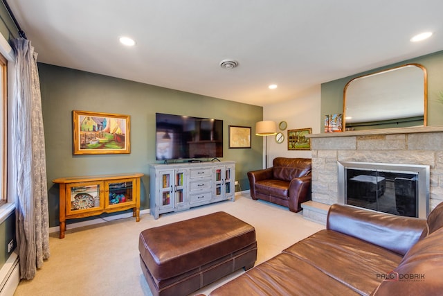 carpeted living room featuring a baseboard radiator and a fireplace