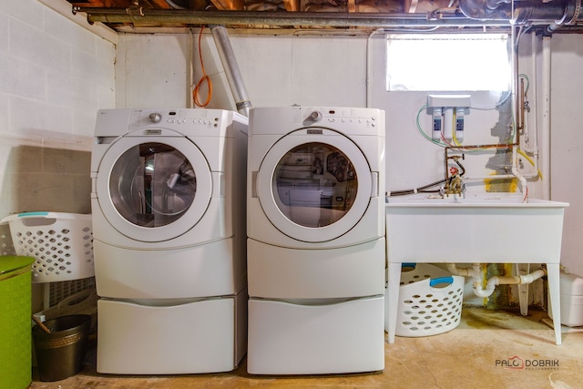 laundry area with washing machine and clothes dryer