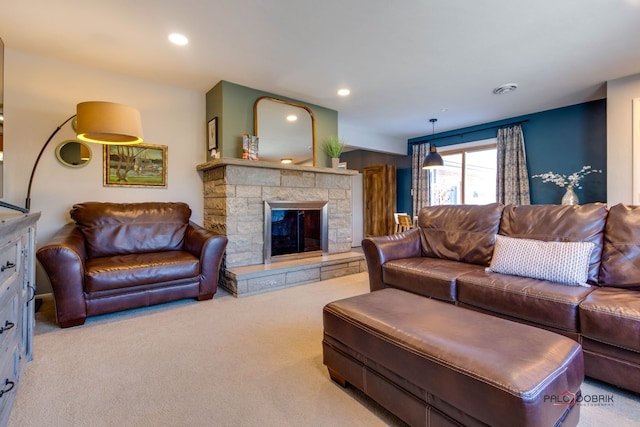 living room featuring light carpet and a fireplace