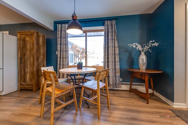 dining room featuring hardwood / wood-style flooring