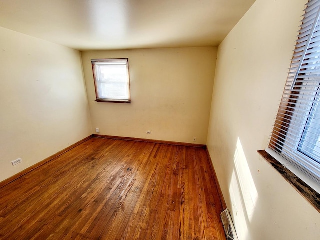 unfurnished room featuring wood-type flooring