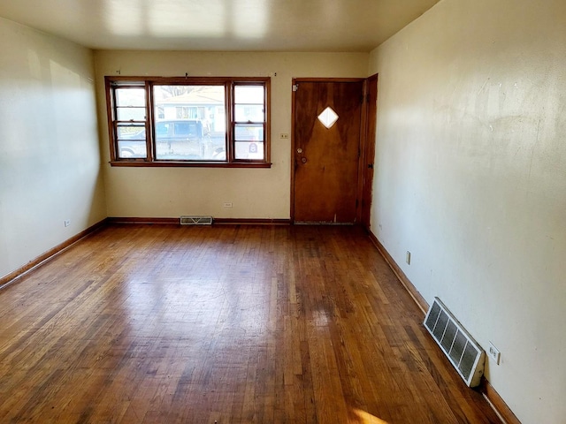 entrance foyer with dark hardwood / wood-style flooring