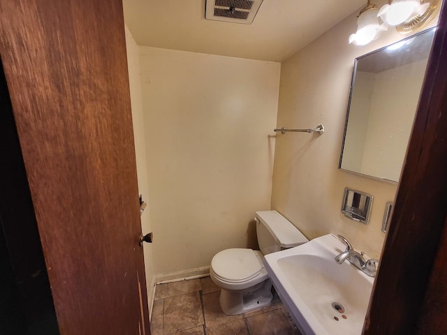 bathroom with toilet and sink