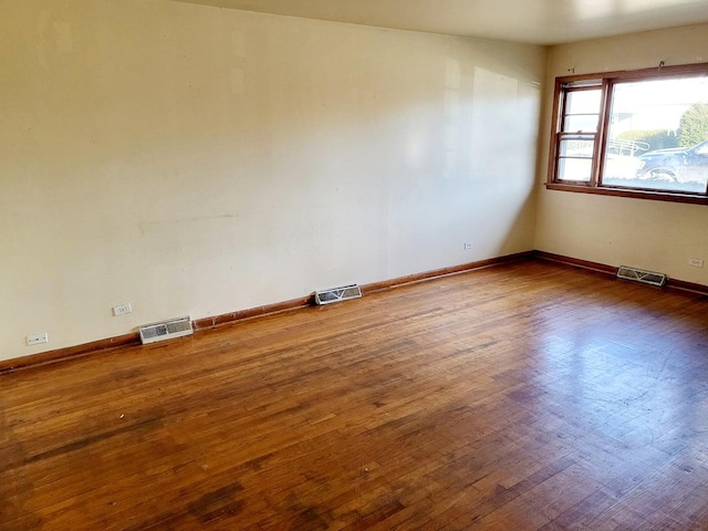 unfurnished room featuring dark hardwood / wood-style flooring