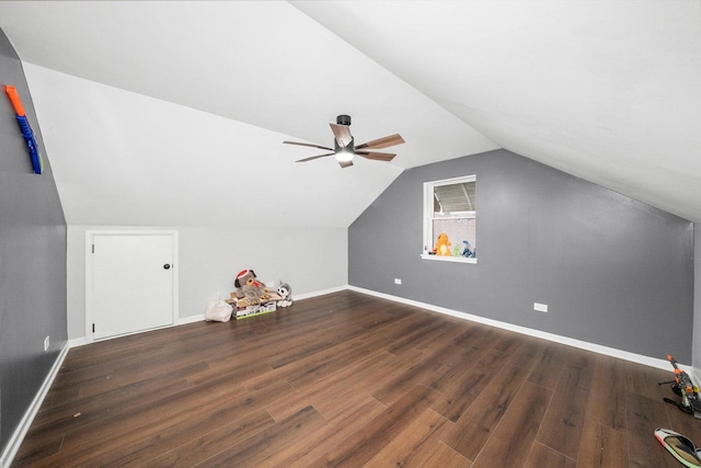 additional living space with vaulted ceiling, ceiling fan, and dark hardwood / wood-style floors