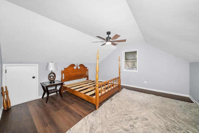 bedroom with ceiling fan, dark hardwood / wood-style flooring, and vaulted ceiling