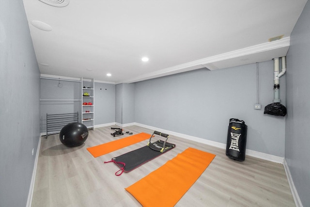 workout area with wood-type flooring