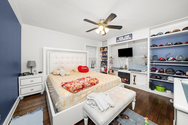 bedroom with ceiling fan and dark hardwood / wood-style flooring