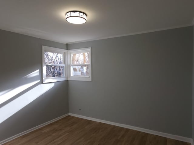 unfurnished room with dark hardwood / wood-style floors