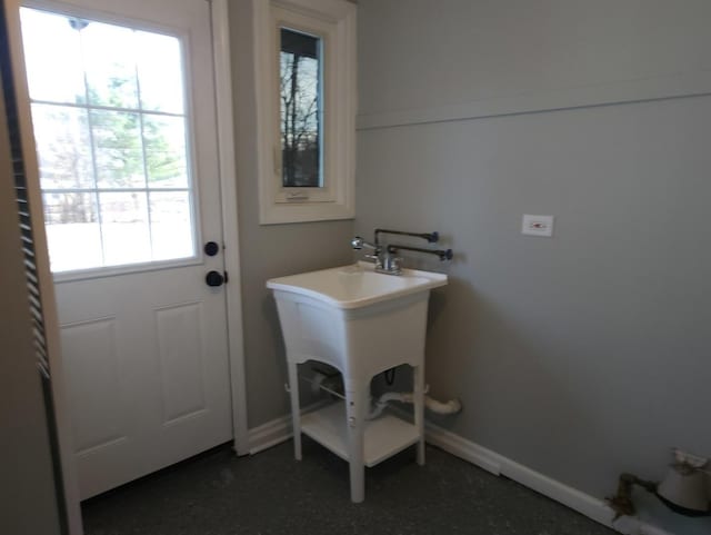 laundry room featuring plenty of natural light