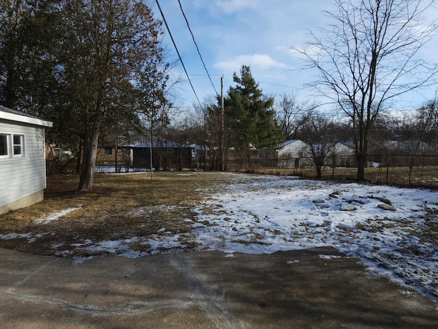 view of yard layered in snow