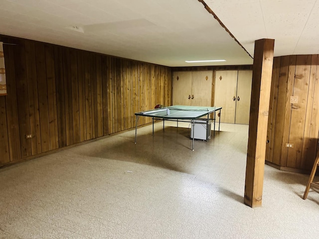 playroom featuring wood walls